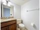 Bathroom features a granite countertop vanity and a toilet at 136 Raintree Dr, Longwood, FL 32779