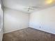 This spacious bedroom features neutral walls, carpeted flooring and a modern ceiling fan at 136 Raintree Dr, Longwood, FL 32779