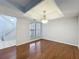 Dining room showing stairs, hardwood floor, and view to the front of the property at 136 Raintree Dr, Longwood, FL 32779