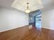 Hardwood floors shine in this dining room offering views of the sunroom at 136 Raintree Dr, Longwood, FL 32779