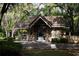 Charming guard house with stone accents, offering security and a welcoming entrance at 136 Raintree Dr, Longwood, FL 32779