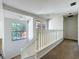 Upstairs hallway featuring views of the front yard and open space at 136 Raintree Dr, Longwood, FL 32779