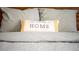 Close up of throw pillow on bed with 'make yourself at HOME' embroidered at 1371 Tuscan Terrace # 3203, Davenport, FL 33896