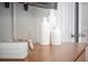Close-up of three modern white vases sitting atop a wooden dresser in a bedroom at 1371 Tuscan Terrace # 3203, Davenport, FL 33896