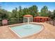 Fun mushroom fountain surrounded by a brick patio and cabanas, adding a playful element to the area at 1371 Tuscan Terrace # 3203, Davenport, FL 33896