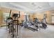 Well-equipped gym featuring various cardio and weight machines for a comprehensive workout experience at 1371 Tuscan Terrace # 3203, Davenport, FL 33896