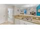 Modern kitchen with granite counter, double sink and opening into living area at 1371 Tuscan Terrace # 3203, Davenport, FL 33896