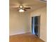 Bedroom with a ceiling fan and sliding glass doors at 1422 Spalding Rd, Winter Springs, FL 32708