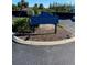 The tennis center sign amidst landscaping indicates tennis, fitness center, and aquatics at 1422 Spalding Rd, Winter Springs, FL 32708