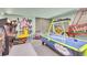 An entertainment space with arcade games, air hockey, colorful accents, and unique decor for a fun atmosphere at 1427 Fairview Cir, Reunion, FL 34747