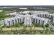 A scenic aerial view shows a stunning resort complex with well-manicured green spaces at 14501 Grove Resort Ave # 2522, Winter Garden, FL 34787