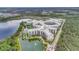 Breathtaking aerial view of resort featuring pond views and lush landscaping at 14501 Grove Resort Ave # 2522, Winter Garden, FL 34787
