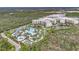 Stunning aerial view of the resort showcasing the pool, lazy river and lush landscape at 14501 Grove Resort Ave # 2522, Winter Garden, FL 34787