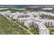 Beautiful aerial view of a resort nestled among trees and lakes, offering a serene retreat at 14501 Grove Resort Ave # 2522, Winter Garden, FL 34787