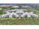 Beautiful aerial view of luxury resort complex featuring lake, fountain, and green landscaping at 14501 Grove Resort Ave # 2522, Winter Garden, FL 34787