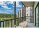 Enjoy the fresh air on this balcony with comfortable seating and a serene view of the lake at 14501 Grove Resort Ave # 2522, Winter Garden, FL 34787