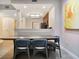 Dining area with a modern table and chairs, complemented by an open-concept design and modern decor at 14501 Grove Resort Ave # 2522, Winter Garden, FL 34787