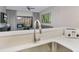 Kitchen view with a stainless steel sink, modern faucet, and a view into the living area at 14501 Grove Resort Ave # 2522, Winter Garden, FL 34787