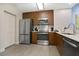 Efficient kitchen with stainless steel appliances, modern wood cabinets, and ample counter space at 14501 Grove Resort Ave # 2522, Winter Garden, FL 34787