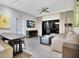 Living room with gray sofa, modern decor, and a sliding glass door to the patio at 14501 Grove Resort Ave # 2522, Winter Garden, FL 34787