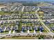 Aerial view of a well-planned community with tree-lined streets at 15255 Honeybell Dr, Winter Garden, FL 34787