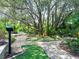 Lush landscaping surrounds the fun miniature golf area with mature trees and native foliage at 1549 Discovery St, Davenport, FL 33896