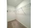 Bright walk-in closet with carpeted floors, wire shelving and white walls at 1549 Discovery St, Davenport, FL 33896