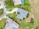 Aerial view of a well-maintained single-Gathering home with a driveway and manicured lawn at 1562 Auburn Oaks Ct, Auburndale, FL 33823