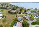 An aerial view of a home's location relative to surrounding properties and a nearby lake at 1562 Auburn Oaks Ct, Auburndale, FL 33823