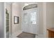 Inviting foyer with white double doors featuring decorative glass panels at 1562 Auburn Oaks Ct, Auburndale, FL 33823