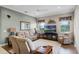 Comfortable living room with neutral tones, a ceiling fan, and wood-look flooring at 1562 Auburn Oaks Ct, Auburndale, FL 33823