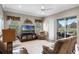 Bright living room featuring a ceiling fan, neutral paint, and sliding glass doors at 1562 Auburn Oaks Ct, Auburndale, FL 33823