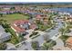 High-definition aerial image of luxurious homes with tile roofs and manicured landscaping in a neighborhood at 15644 Panther Lake Dr, Winter Garden, FL 34787