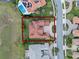 Aerial view of a sprawling neighborhood showcasing a large home, neighboring properties and manicured lawns at 15644 Panther Lake Dr, Winter Garden, FL 34787