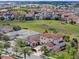 Expansive aerial view of homes with red tile roofs surrounded by greenery and manicured lawns at 15644 Panther Lake Dr, Winter Garden, FL 34787