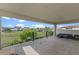 View from covered balcony of beautiful homes and manicured green lawn at 15644 Panther Lake Dr, Winter Garden, FL 34787