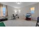 Bright and airy bedroom featuring carpet, a large window, and a functional workspace at 15644 Panther Lake Dr, Winter Garden, FL 34787