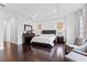 Well-lit main bedroom with hardwood floors, recessed lighting, and tasteful furnishings at 15644 Panther Lake Dr, Winter Garden, FL 34787