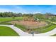 Community playground with swings, slides, and climbing structures, perfect for children to play and explore at 1612 Barberry Dr, Kissimmee, FL 34744