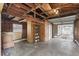 Empty garage with storage shelving and exposed wood and concrete floors at 1975 Staunton Ave, Winter Park, FL 32789