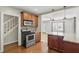 Modern kitchen featuring stainless steel appliances, granite countertops and ample cabinet space at 1975 Staunton Ave, Winter Park, FL 32789