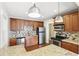 Modern kitchen featuring stainless steel appliances, granite countertops and ample cabinet space at 1975 Staunton Ave, Winter Park, FL 32789