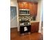 Kitchen featuring wooden cabinets, stainless steel microwave, countertop, and stove, with hardwood floors at 1975 Staunton Ave, Winter Park, FL 32789