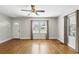 Bright living room featuring hardwood floors, a ceiling fan and plenty of natural light at 1975 Staunton Ave, Winter Park, FL 32789