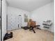 Bedroom featuring neutral carpet, a window, gym equipment and storage shelves at 2056 Switch Grass Cir, Ocoee, FL 34761