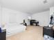 Bright bedroom with beige carpet, white walls, and a window for natural light at 2056 Switch Grass Cir, Ocoee, FL 34761