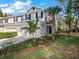 Inviting home exterior featuring a well-manicured lawn and tasteful landscaping at 2056 Switch Grass Cir, Ocoee, FL 34761