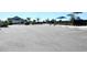 Spacious community parking lot with dedicated parking spaces for residents and guests near amenities at 2294 Sunset Way, Davenport, FL 33837