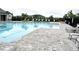 Community pool with lane markers, lounge chairs, and a well-maintained pool deck at 2294 Sunset Way, Davenport, FL 33837