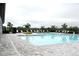 Community pool featuring lounge chairs, a clear blue pool, and a well-maintained surrounding area at 2294 Sunset Way, Davenport, FL 33837